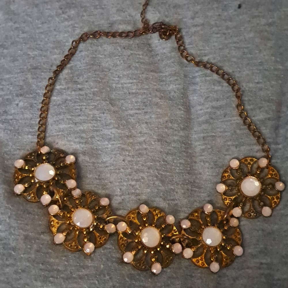 Brown necklace with white or light pink stones